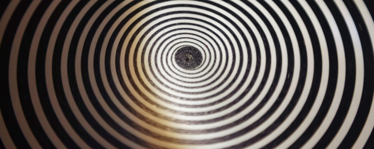 Hypnotic Black and White Spiral Pattern, backdrop. Close-up view of concentric black and white spiral creating an optical illusion, delusion poster. Abstract backgrounds concept. Copy ad text space